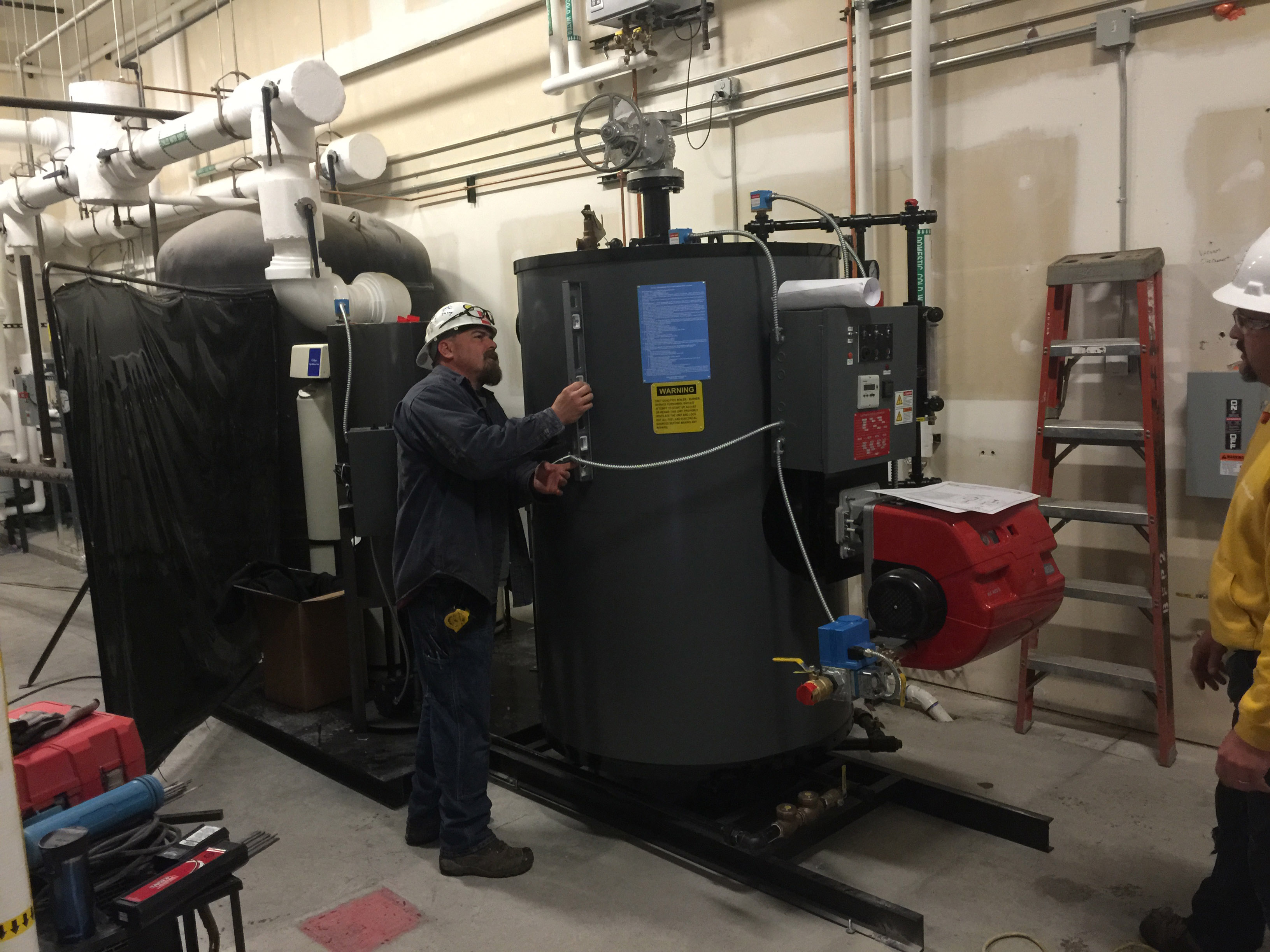 Man Completing Boiler Maintenance